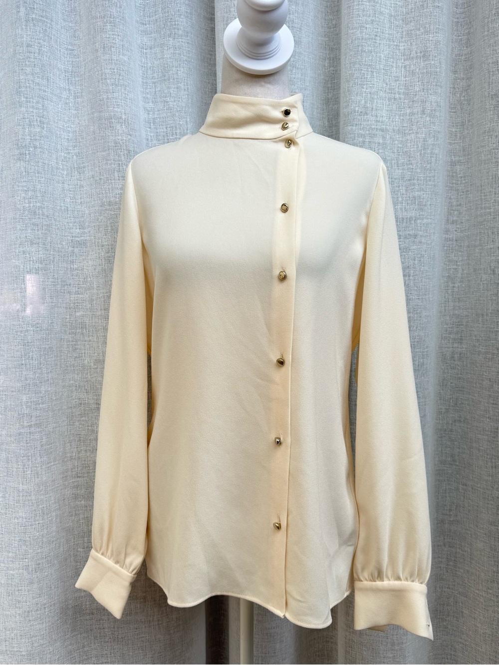 Carlisle Collection ivory button down high neck asymmetrical closure blouse